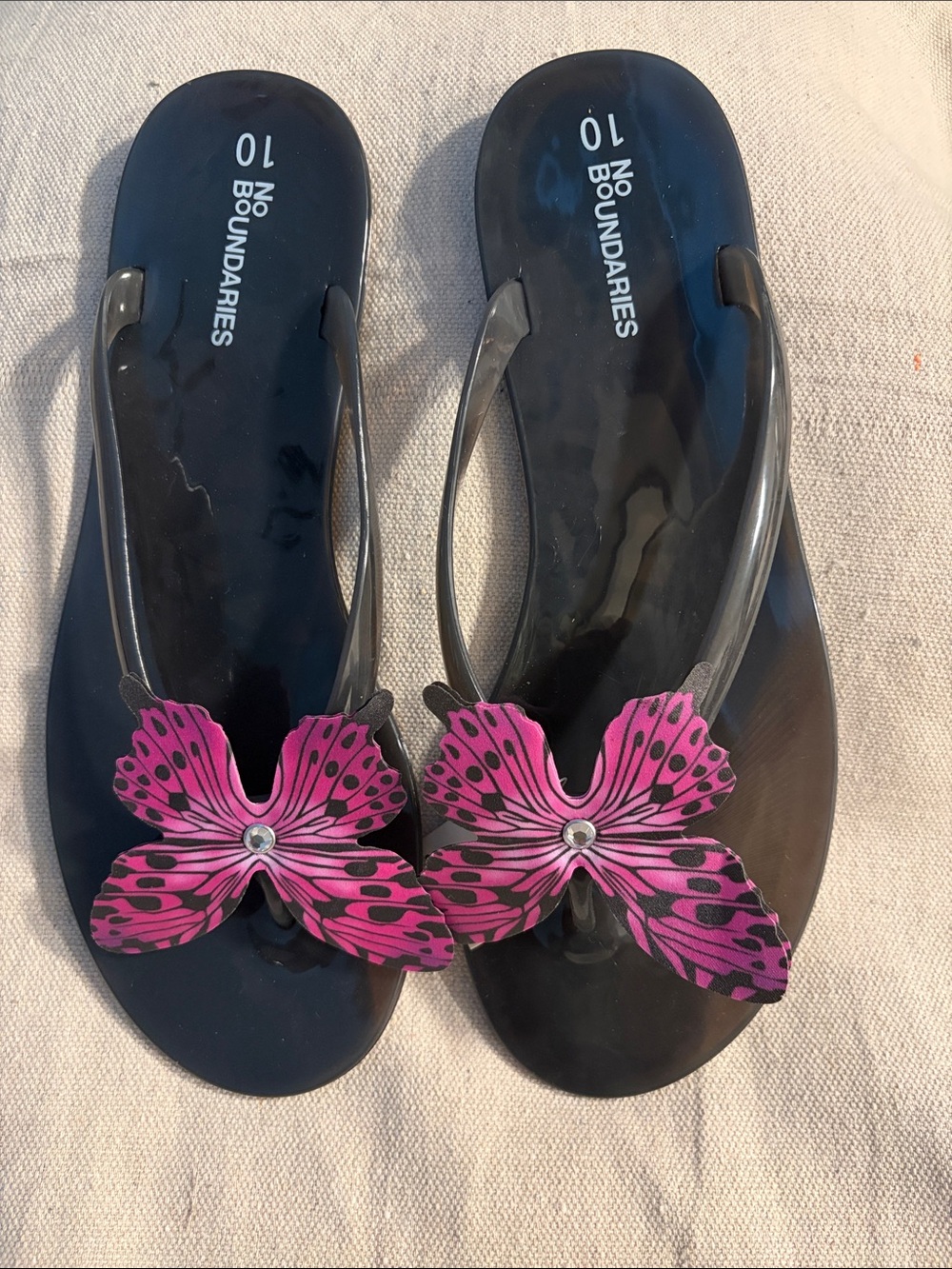No Boundaries Black Flip Flop Sandals with Pink Floral Accent